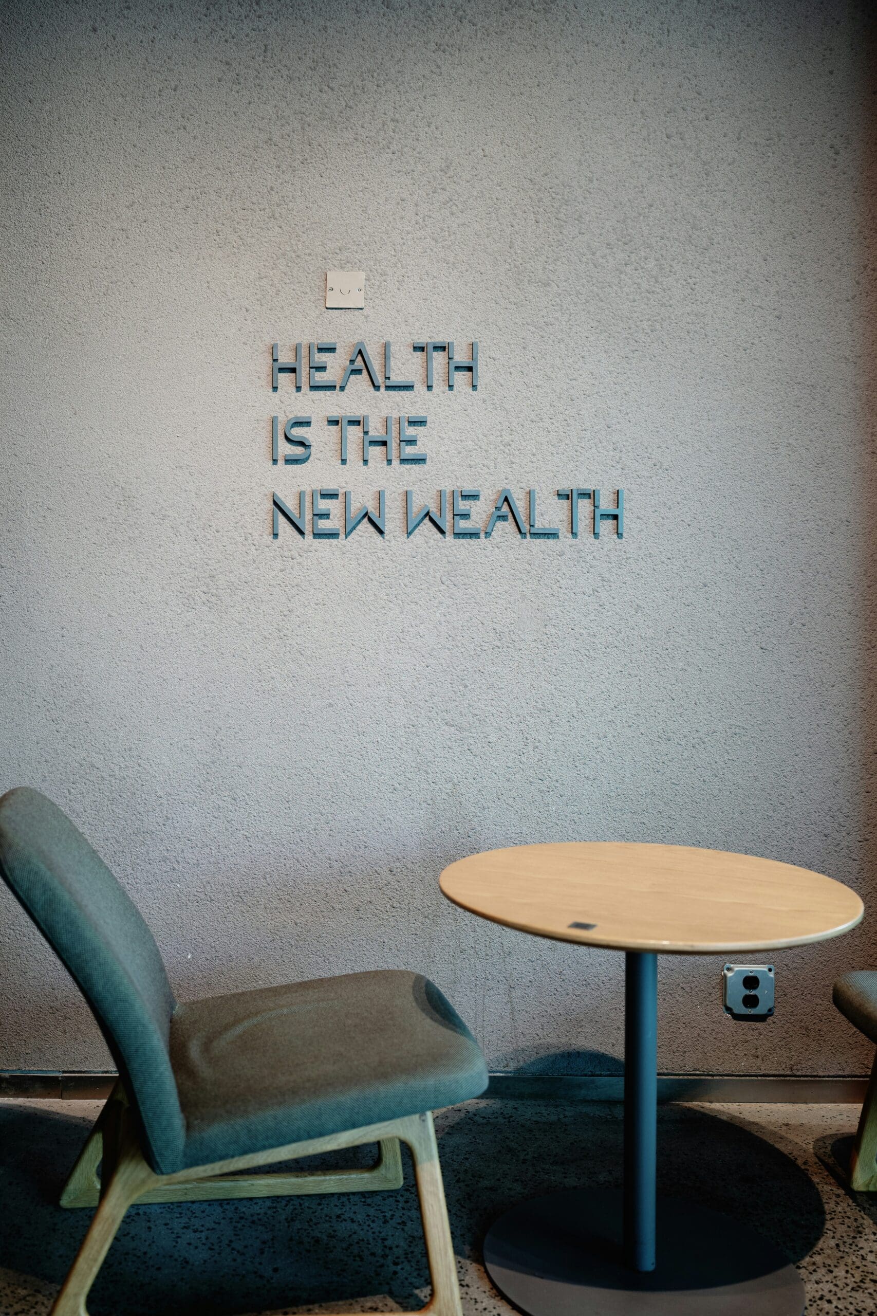 Health is the new wealth sign representing GLP-1 weight loss and employer insurance coverage challenges
