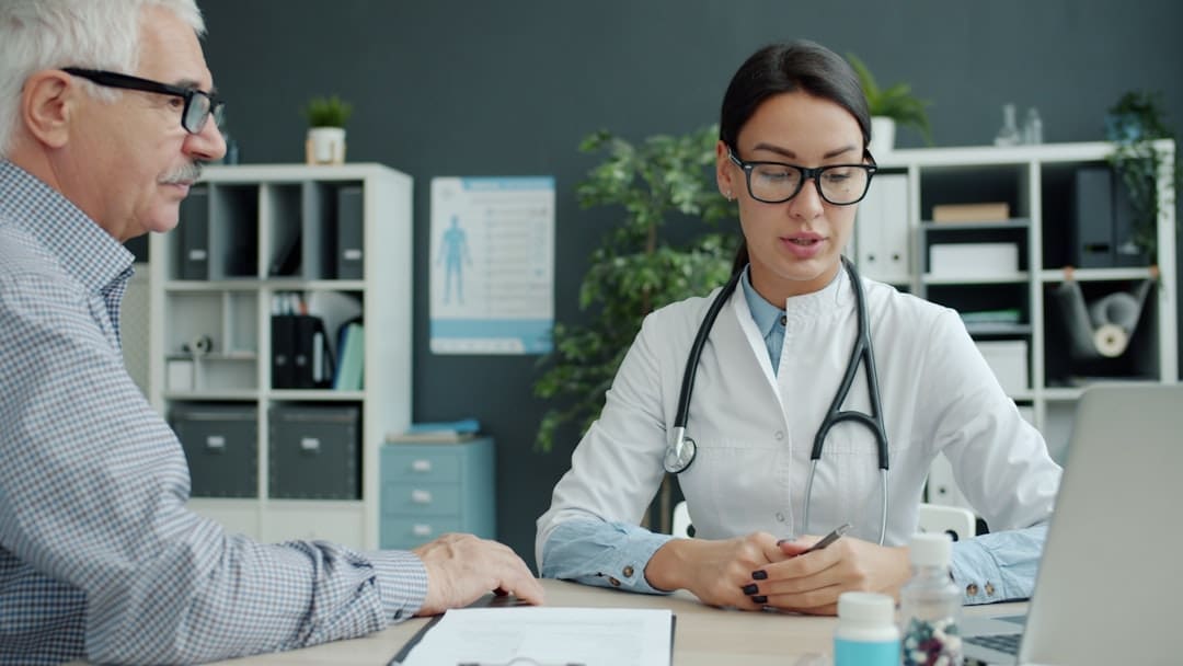Older Medicare patient talking with a medical provider about GLP-1 weight loss medication coverage